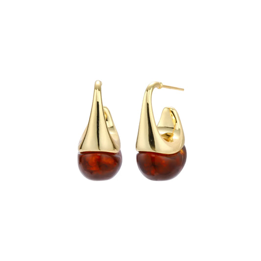 Modern drop earrings with curved gold-plated copper tops and amber resin bottoms creating an organic teardrop silhouette.