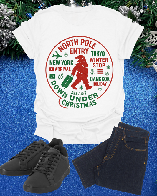 Christmas Travel Graphic T-Shirt — 'North Pole Down Under' Vintage Santa Design Printify